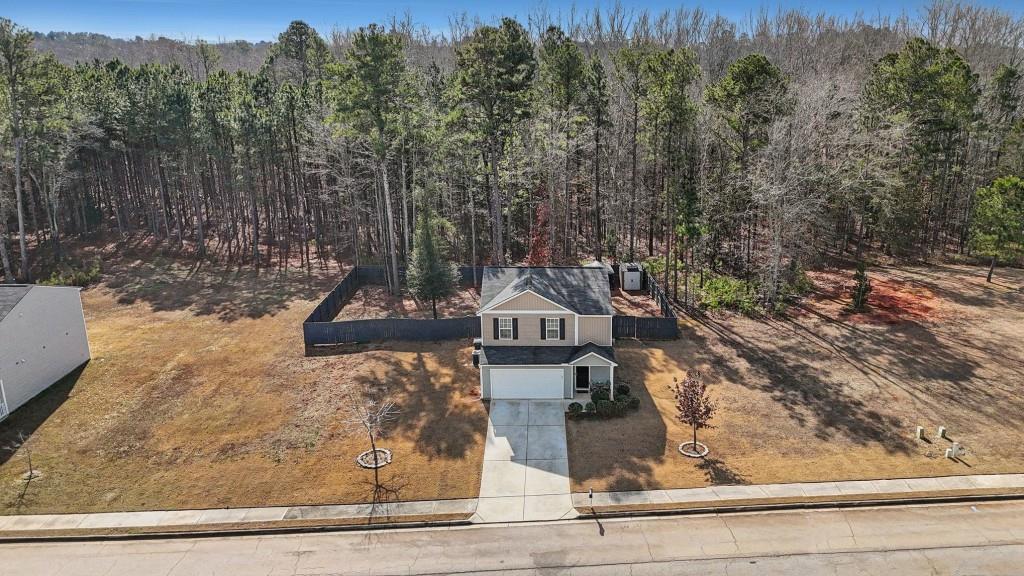 345 Arthurs Lane Covington, GA 30016 - Photo 5 of 33 a front view of a house with trees