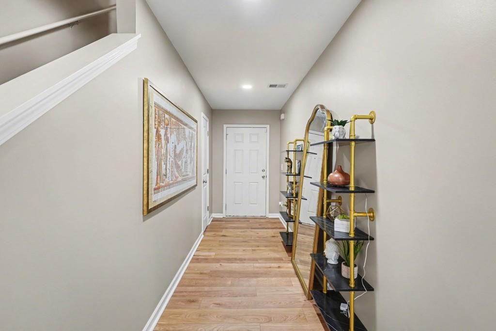 345 Arthurs Lane Covington, GA 30016 - Photo 9 of 33 a view of entryway with furniture and wooden floor