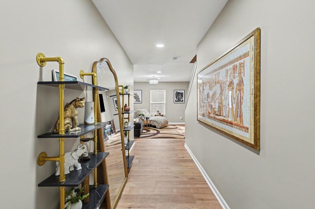 345 Arthurs Lane Covington, GA 30016 - Photo 10 of 33 a living room with lots of furniture and gym equipment