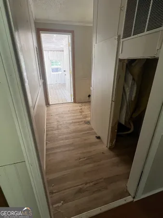 a kitchen with granite countertop a refrigerator and a sink