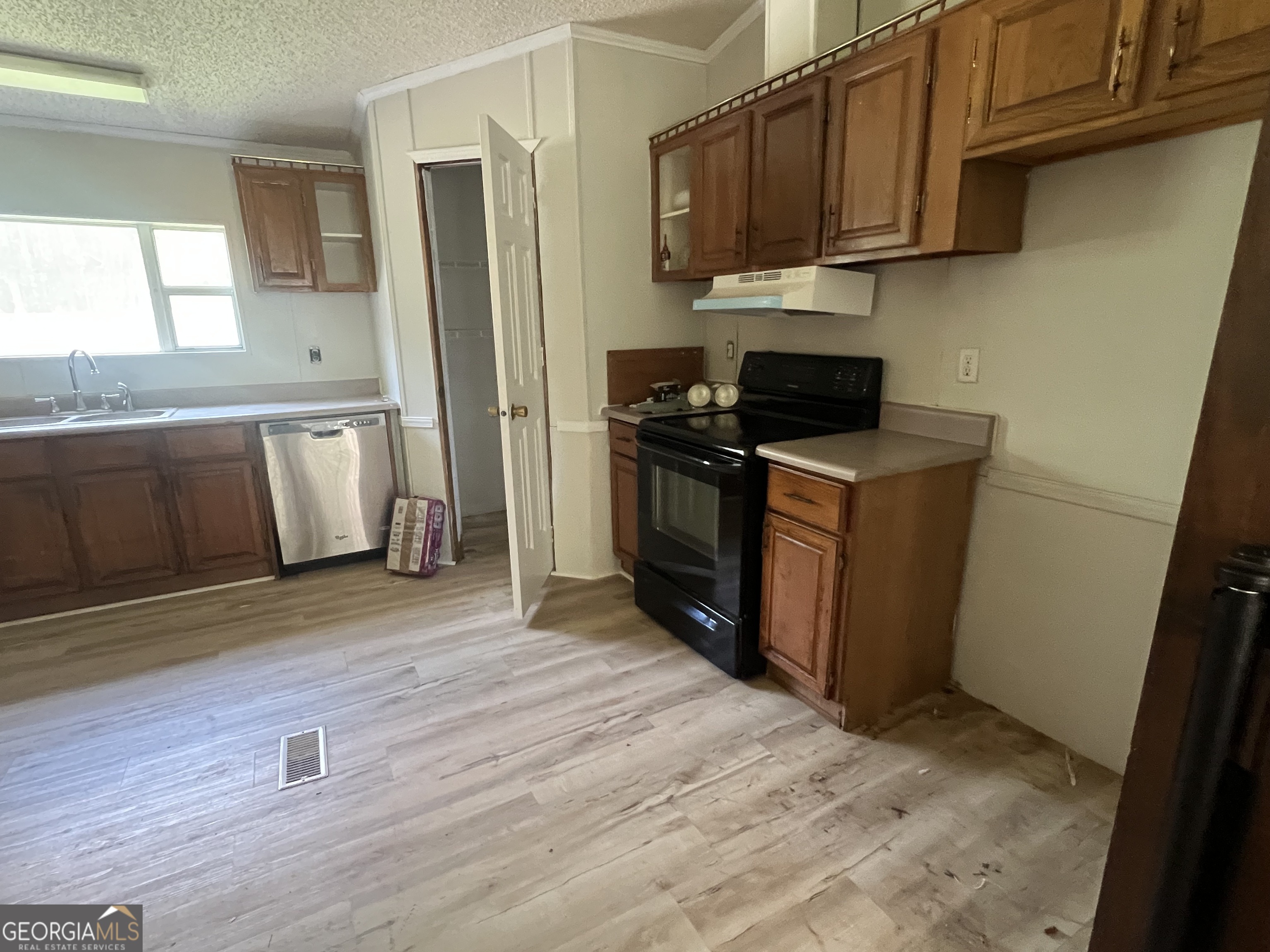 905 Natures Trail Forsyth, GA 31029 - Photo 14 of 59 a kitchen with stainless steel appliances granite countertop a stove a sink and a refrigerator