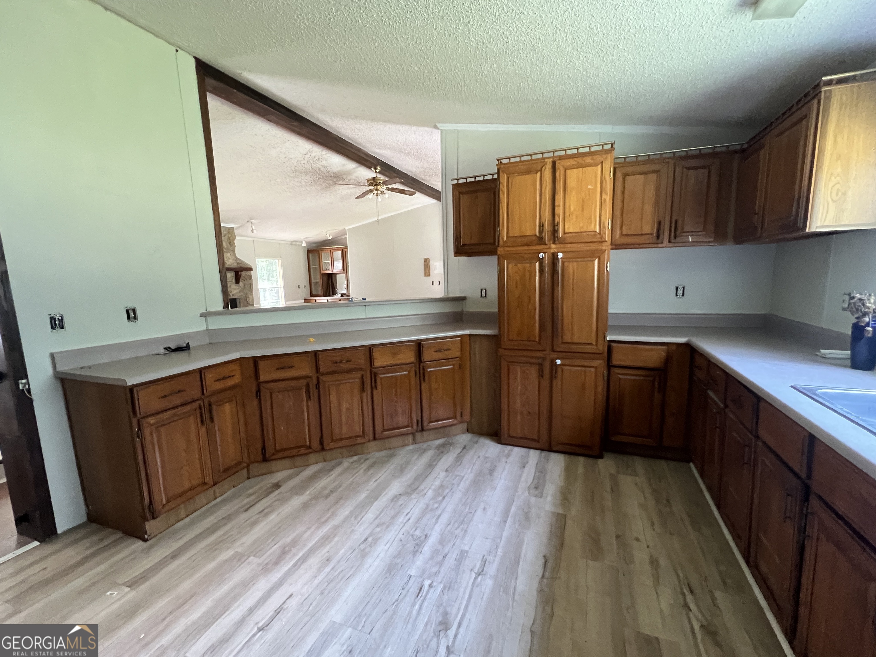 905 Natures Trail Forsyth, GA 31029 - Photo 17 of 59 a kitchen with stainless steel appliances granite countertop a refrigerator a sink dishwasher a stove and wooden floors