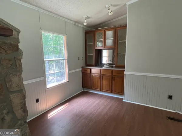 a spacious bathroom with a sink a mirror and a shower