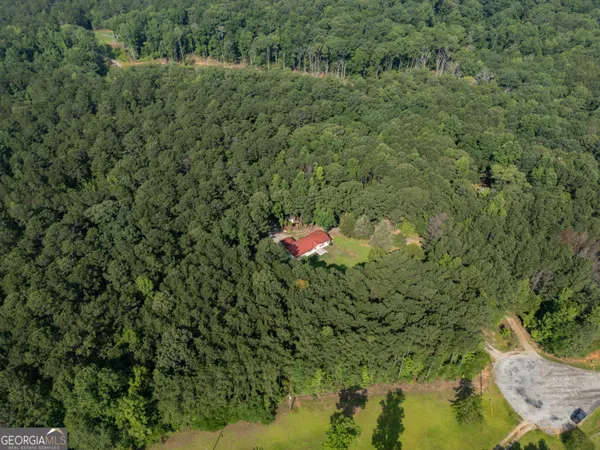 an aerial view of residential house with outdoor space