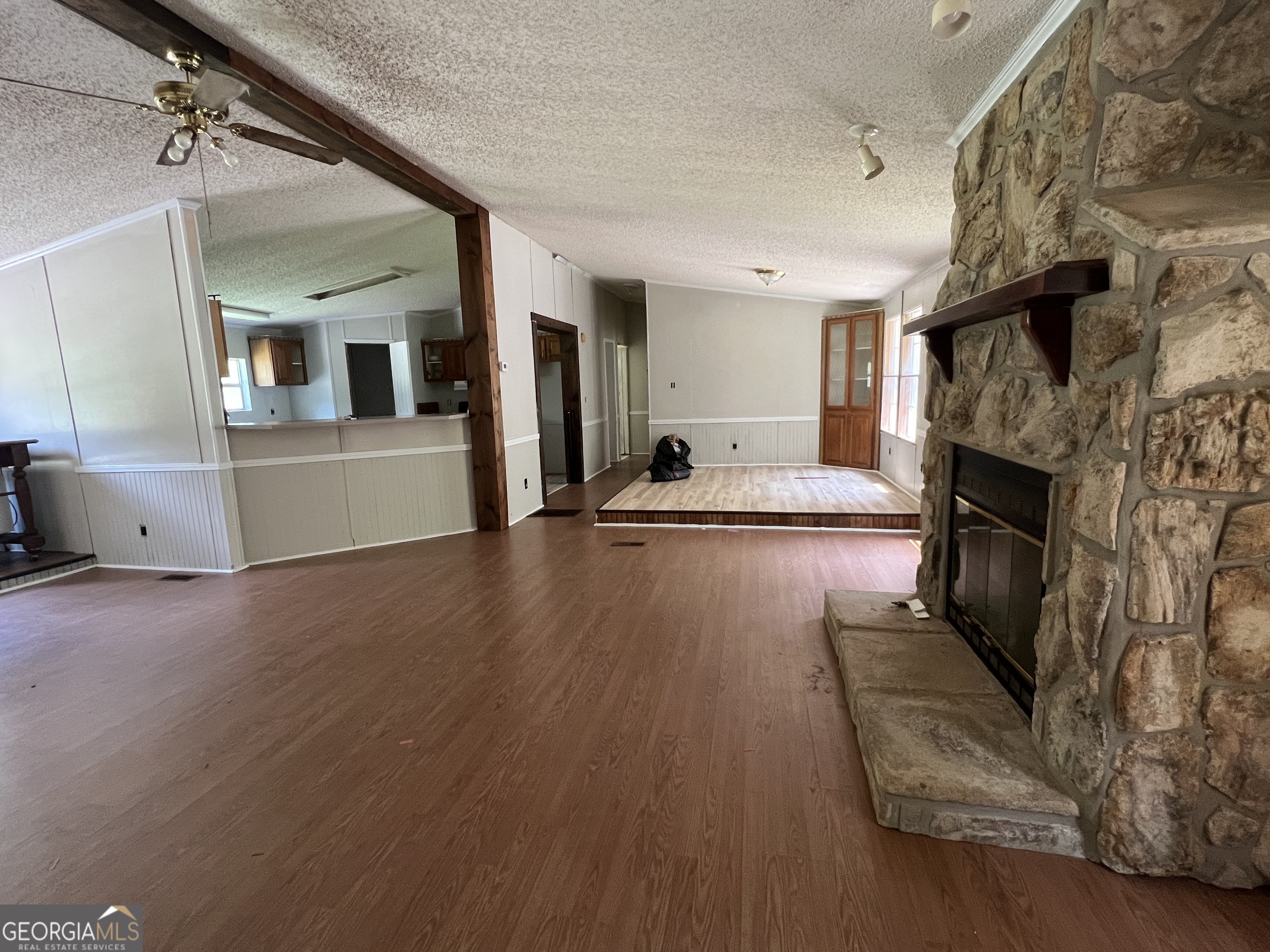 905 Natures Trail Forsyth, GA 31029 - Photo 21 of 59 a living room with furniture and a fireplace