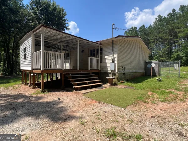 a kitchen with stainless steel appliances wooden cabinets a refrigerator and a stove