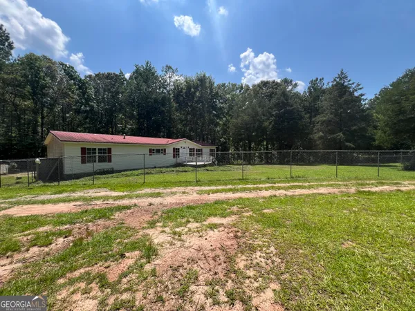 a view of an empty room with a fireplace