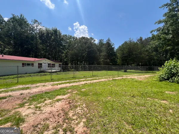 a view of outdoor space with trees all around