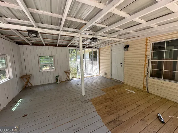 a view of a deck with a yard