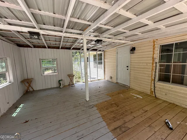 a view of a deck with a yard