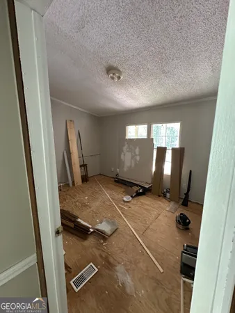 a view of a backyard with large trees