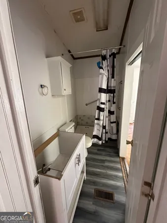 a view of a park with large trees