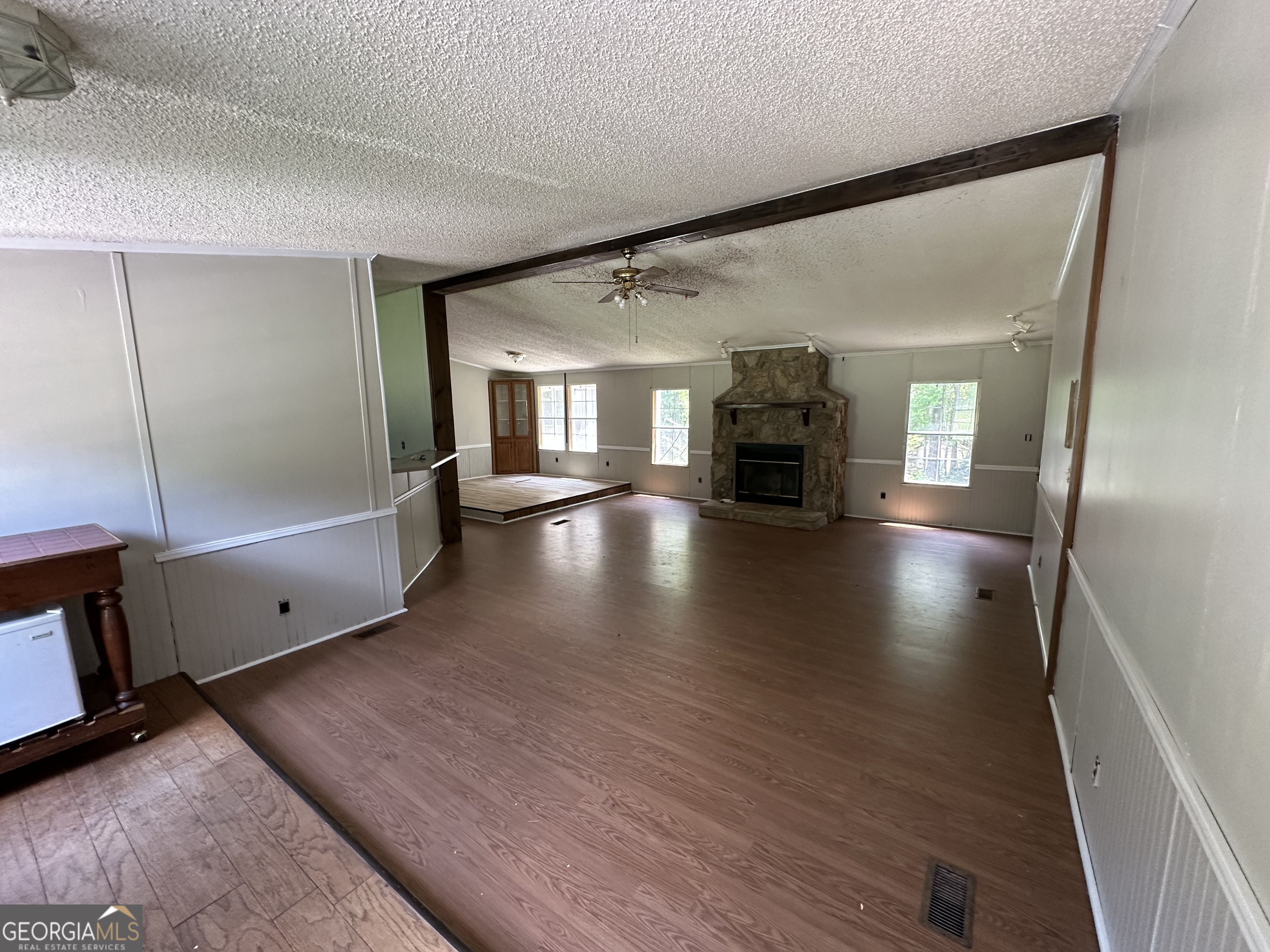905 Natures Trail Forsyth, GA 31029 - Photo 45 of 59 a view of livingroom with hardwood floor and fireplace