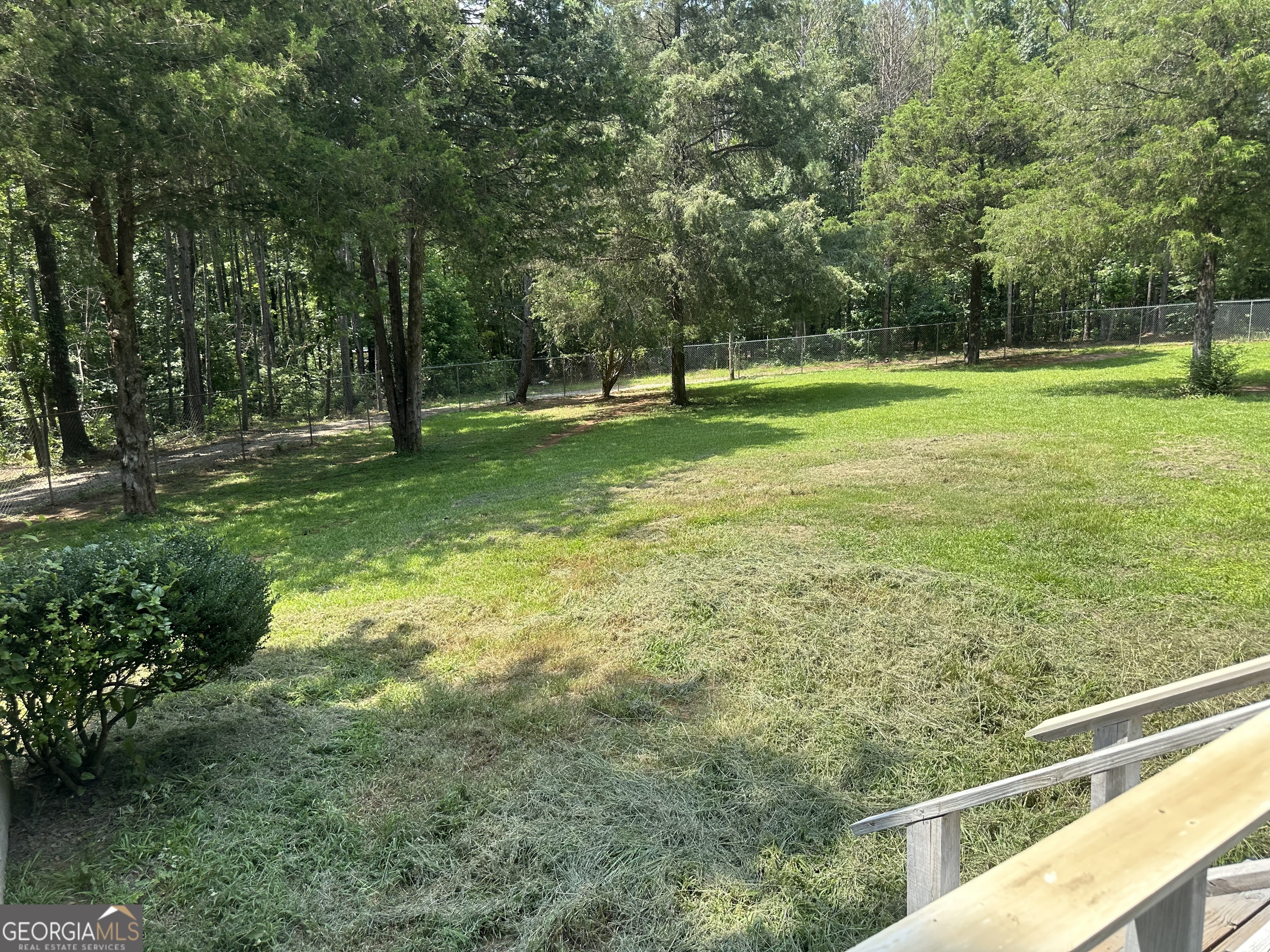 905 Natures Trail Forsyth, GA 31029 - Photo 47 of 59 a view of outdoor space with trees all around