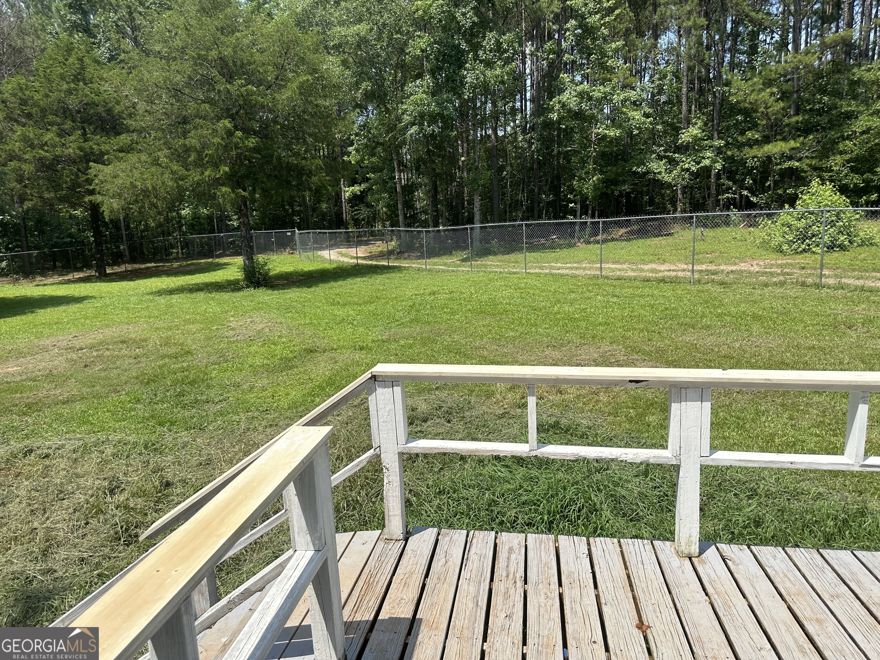 905 Natures Trail Forsyth, GA 31029 - Photo 48 of 59 a view of a deck with a yard