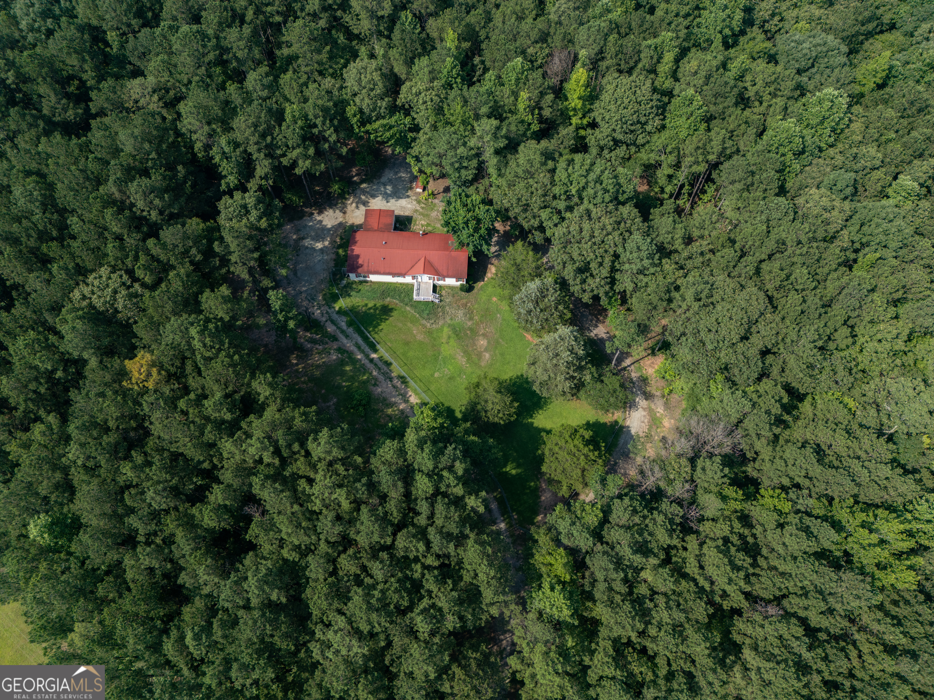 905 Natures Trail Forsyth, GA 31029 - Photo 7 of 59 a backyard of a house with a yard and tree