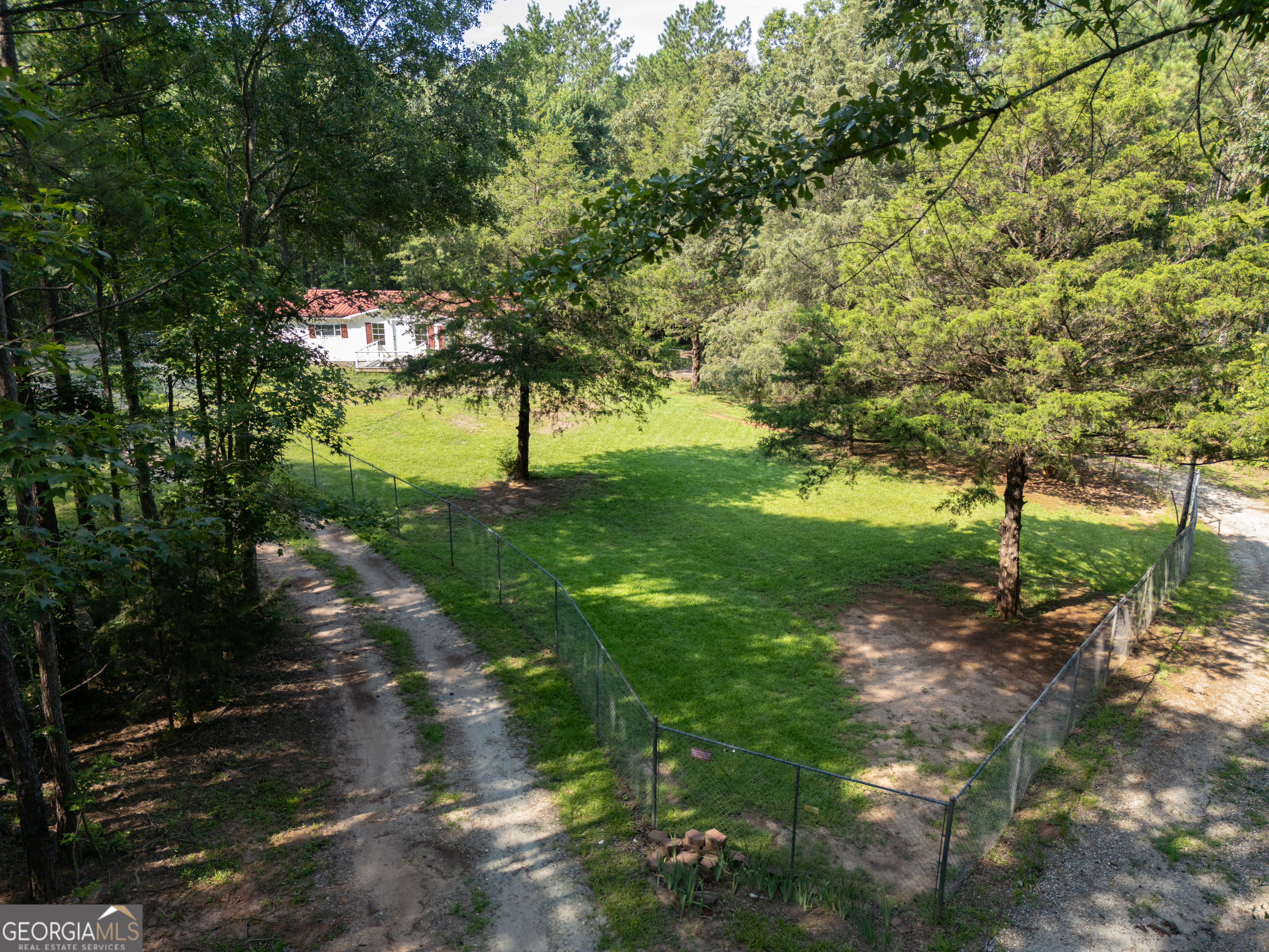 905 Natures Trail Forsyth, GA 31029 - Photo 9 of 59 a big yard with lots of green space and fountain