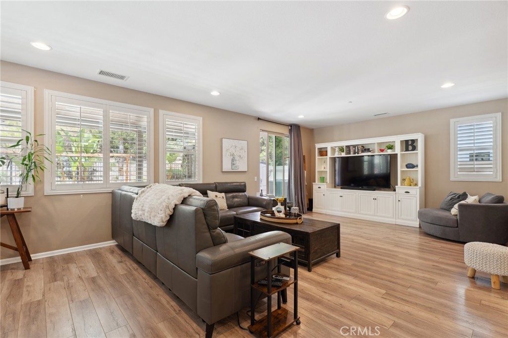 11266 Hutton Road Corona, CA 92883 - Photo 11 of 33 a living room with furniture and a flat screen tv