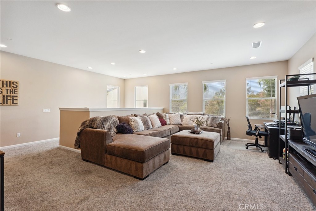 11266 Hutton Road Corona, CA 92883 - Photo 14 of 33 a living room with furniture and a flat screen tv