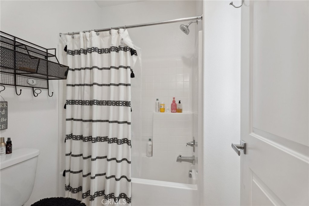 11266 Hutton Road Corona, CA 92883 - Photo 17 of 33 a bathroom with a shower and a bathtub