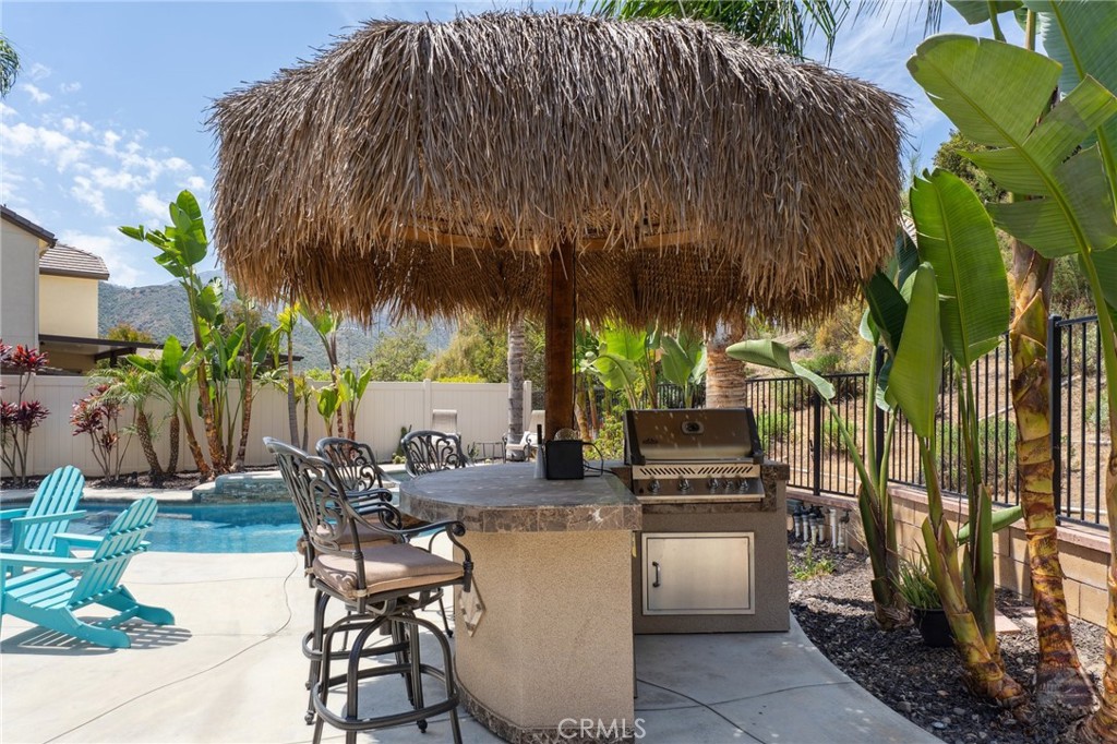 11266 Hutton Road Corona, CA 92883 - Photo 22 of 33 a swimming pool with outdoor seating and yard
