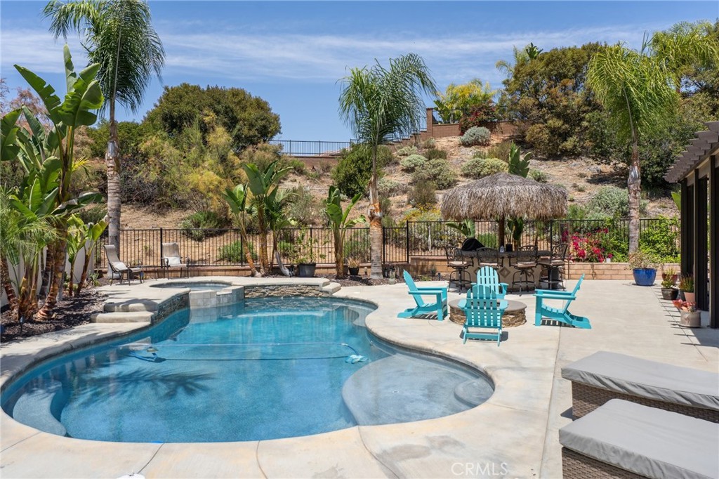 11266 Hutton Road Corona, CA 92883 - Photo 23 of 33 a view of a swimming pool with outdoor seating