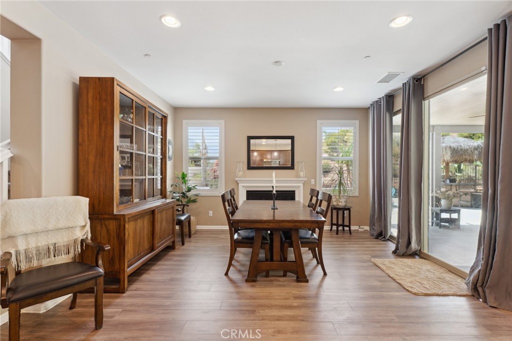 11266 Hutton Road Corona, CA 92883 - Photo 5 of 33 a dining room with furniture window and wooden floor