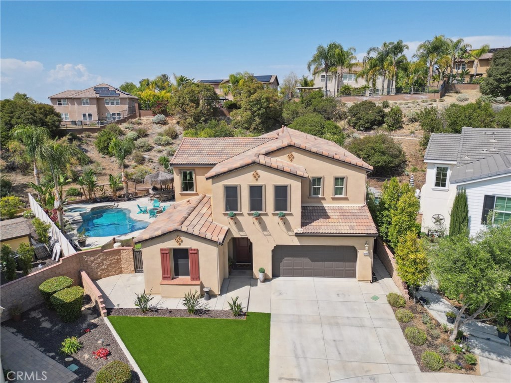11266 Hutton Road Corona, CA 92883 - Photo 8 of 33 a front view of a house with garden