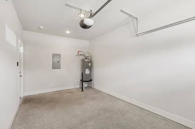 an empty room with a ceiling fan and a window