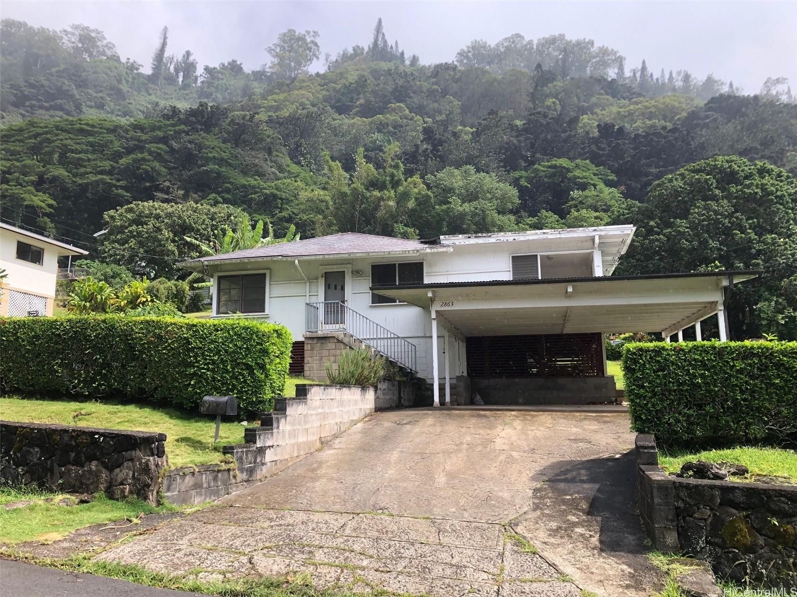 2863 Booth Road Honolulu, HI 96813 - Photo 1 of 1 a view of a house with a yard and sitting area