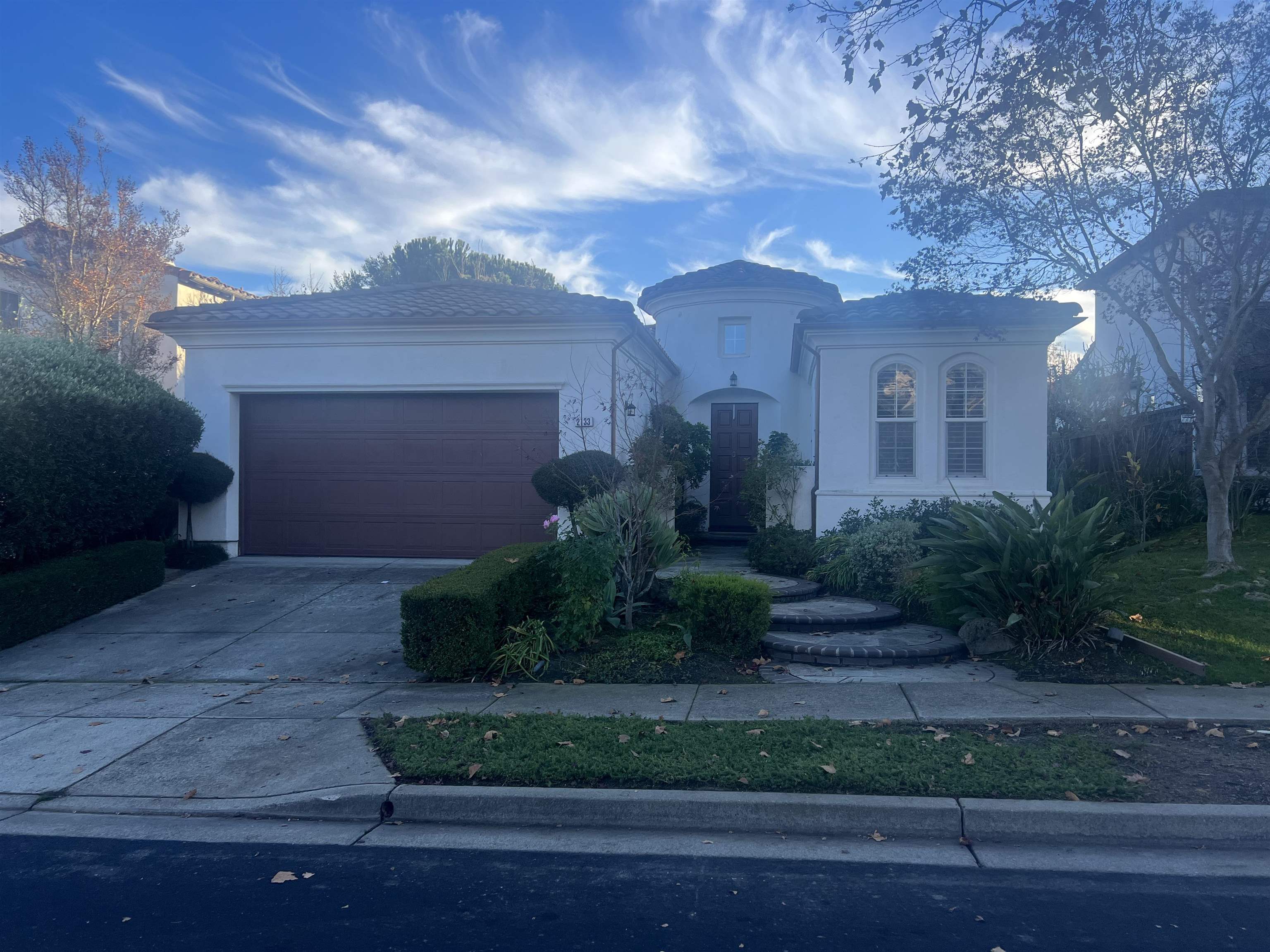 a front view of a house with a yard
