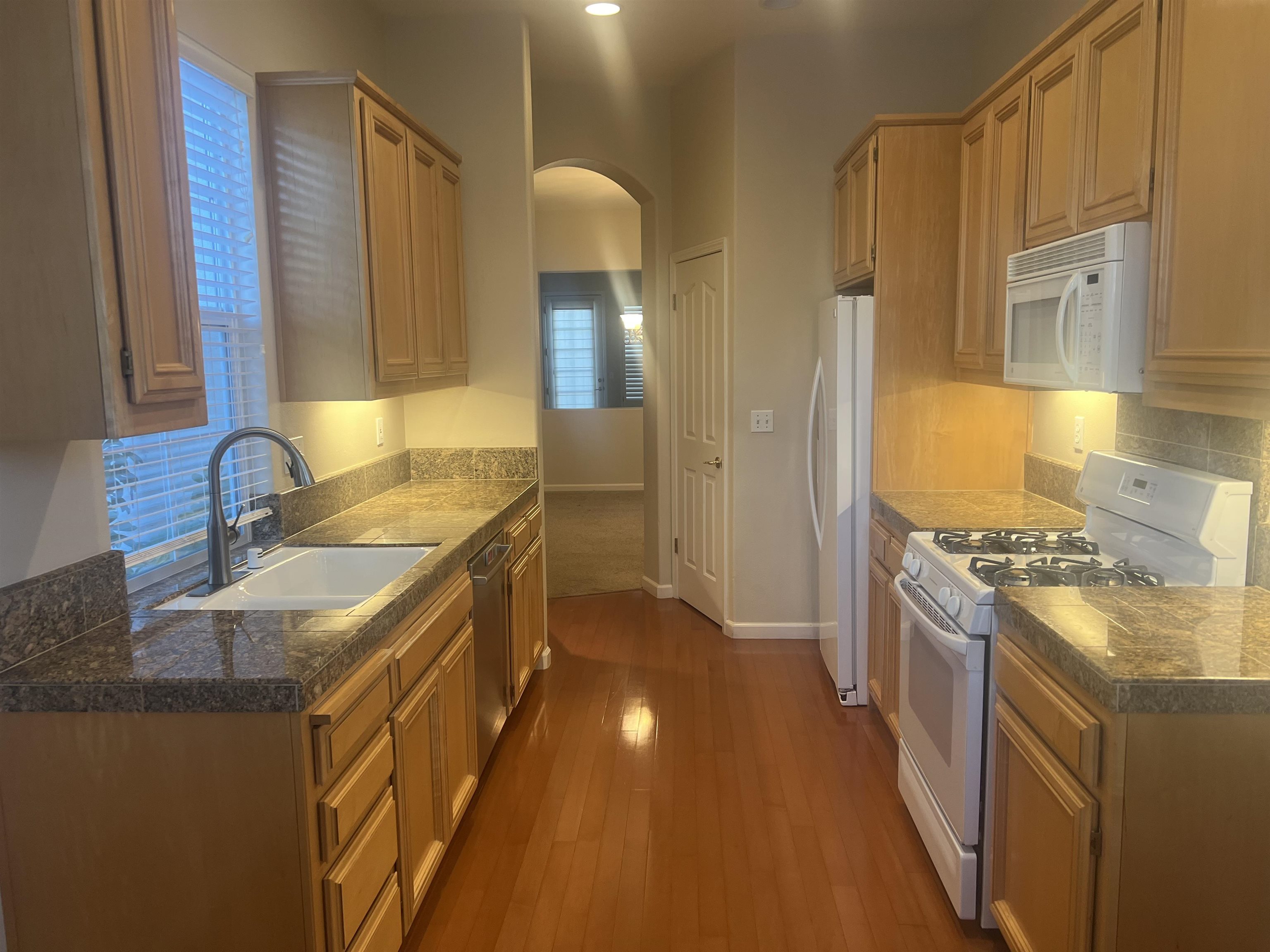 2133 Watercress Place San Ramon, CA 94582 - Photo 2 of 21 a kitchen with stainless steel appliances granite countertop a sink stove and refrigerator