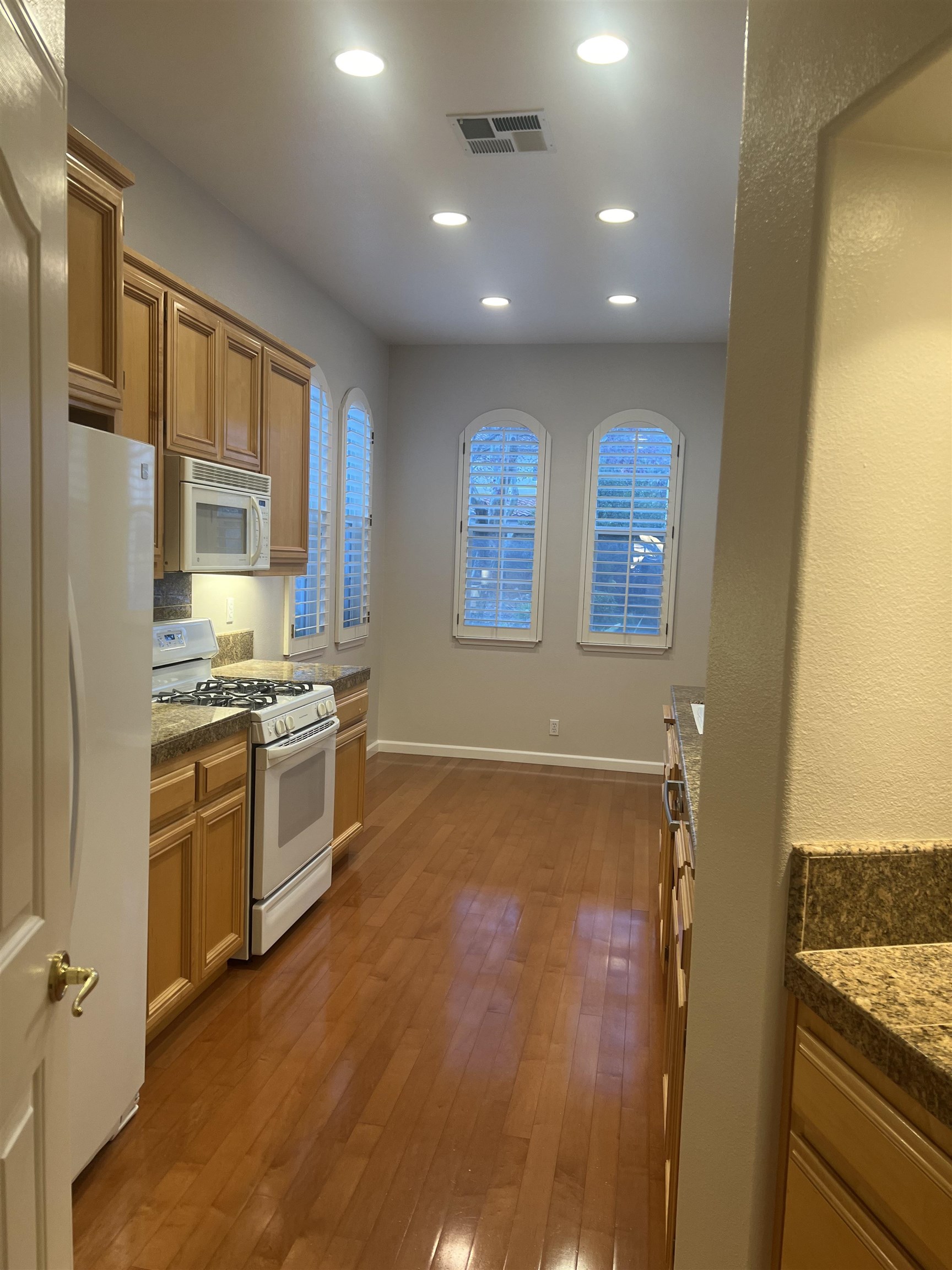 2133 Watercress Place San Ramon, CA 94582 - Photo 3 of 21 a kitchen with stainless steel appliances granite countertop a stove and a refrigerator