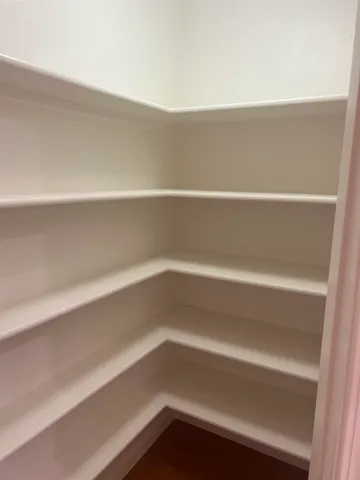 a view of an empty walk in closet