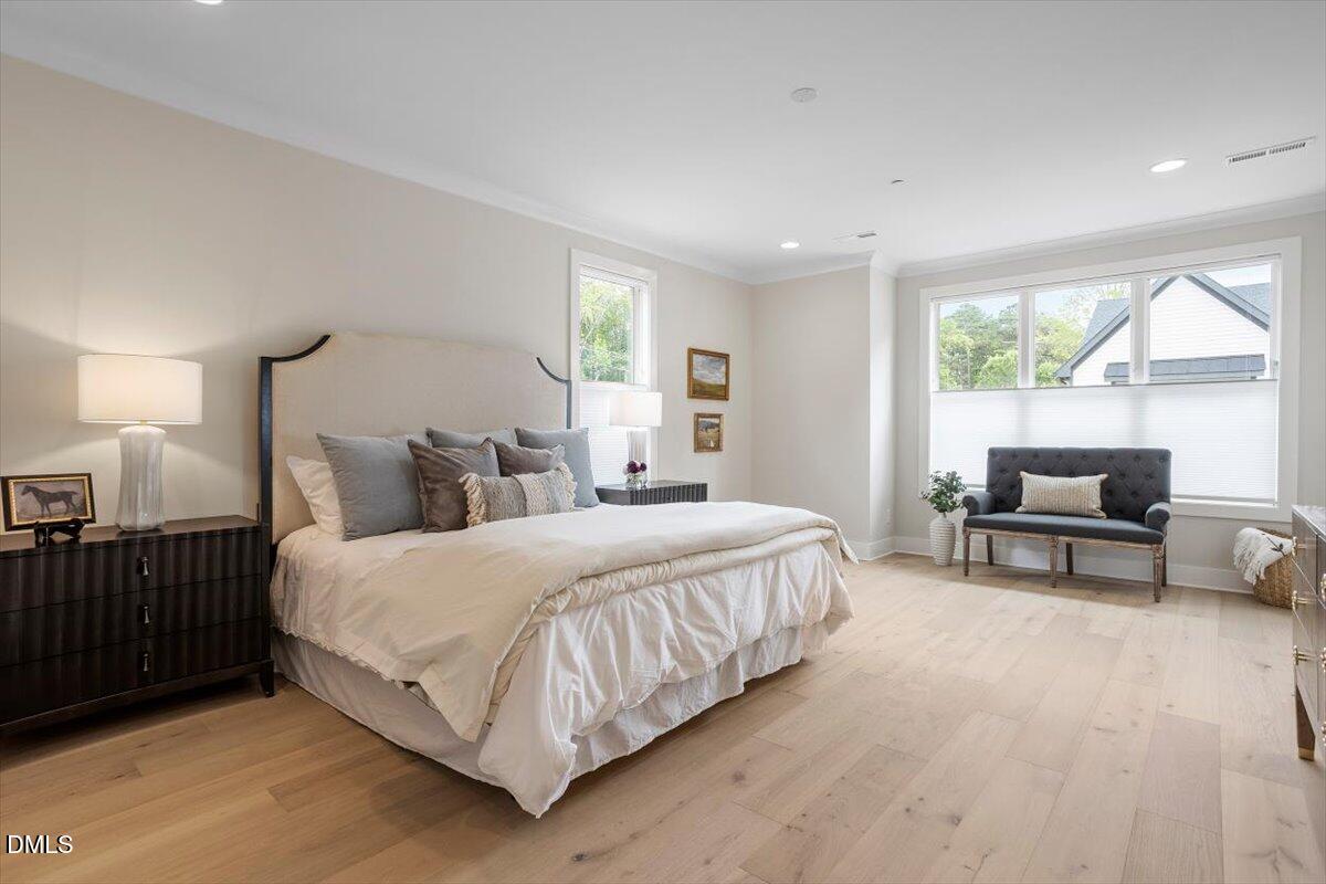 811 Maple Berry Lane, Unit 101 Raleigh, NC 27607 - Photo 23 of 45 a bedroom with a bed and a couch