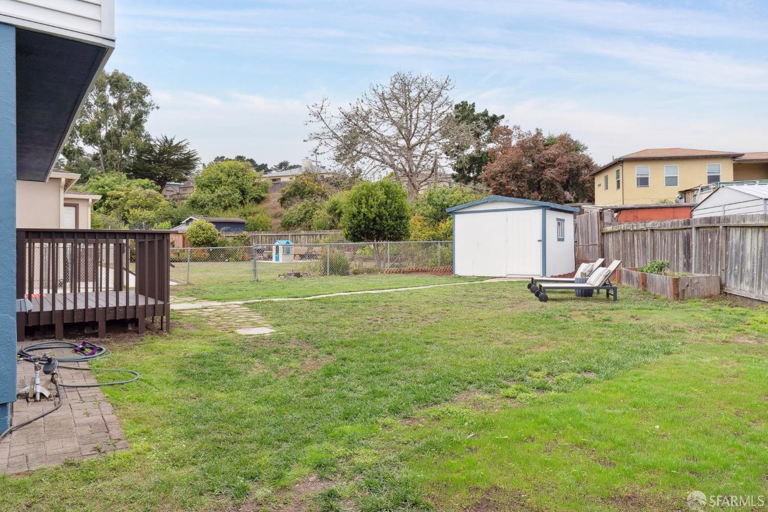512 Macarthur Drive Daly City, CA 94015 - Photo 49 of 53 a view of a house with backyard and a tree