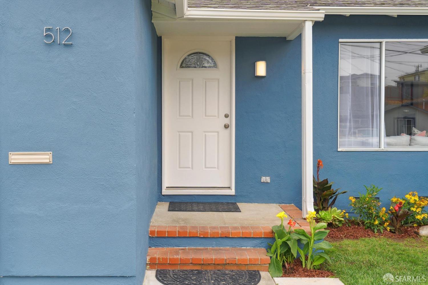 512 Macarthur Drive Daly City, CA 94015 - Photo 5 of 53 a front view of a house with an outdoor space