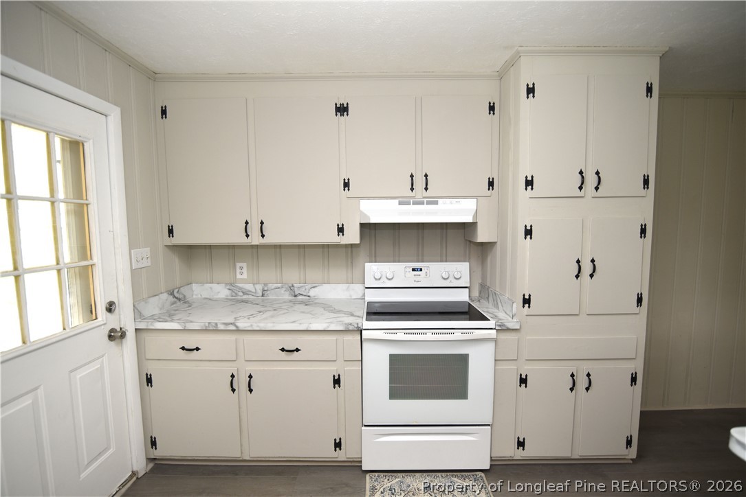 1673 Norment Road Lumberton, NC 28360 - Photo 11 of 32 a kitchen with cabinets appliances and a window
