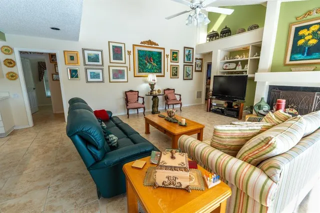 a living room with furniture fireplace and a flat screen tv
