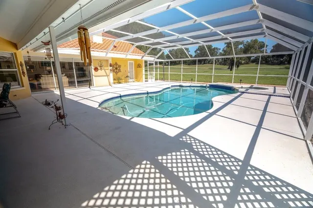 a view of a swimming pool with a patio