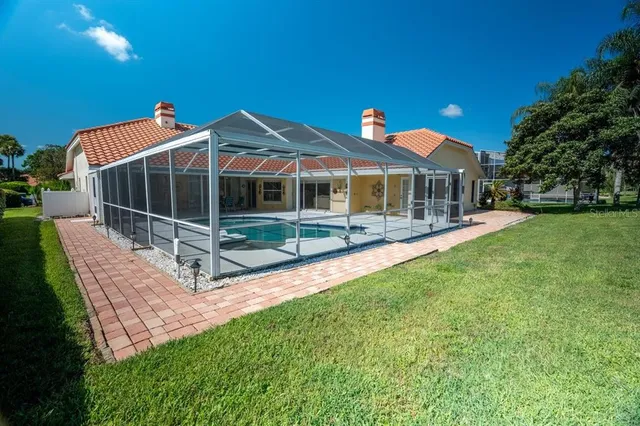 a view of a house with a yard patio and a yard