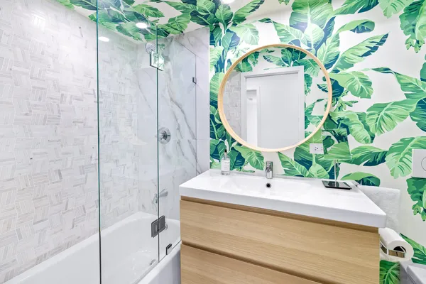 a bathroom with a sink and mirror