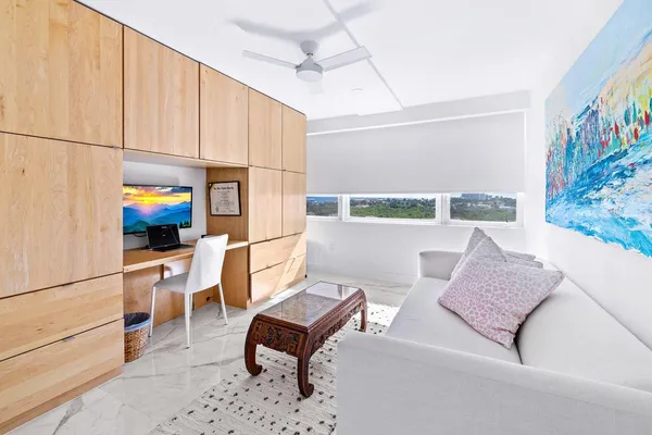 a living room with furniture and a rug
