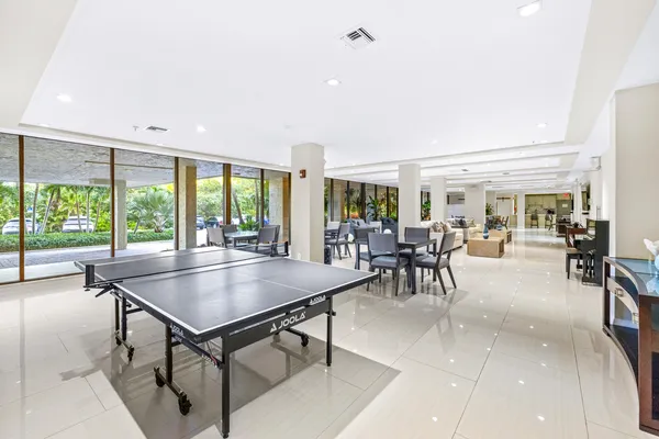 a dining room with furniture water view and a garden