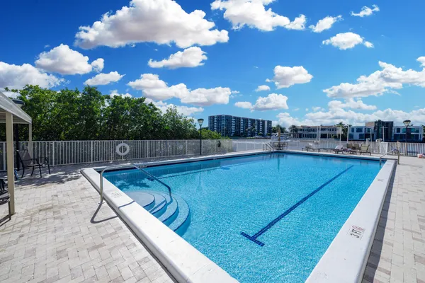 a view of swimming pool with outdoor seating
