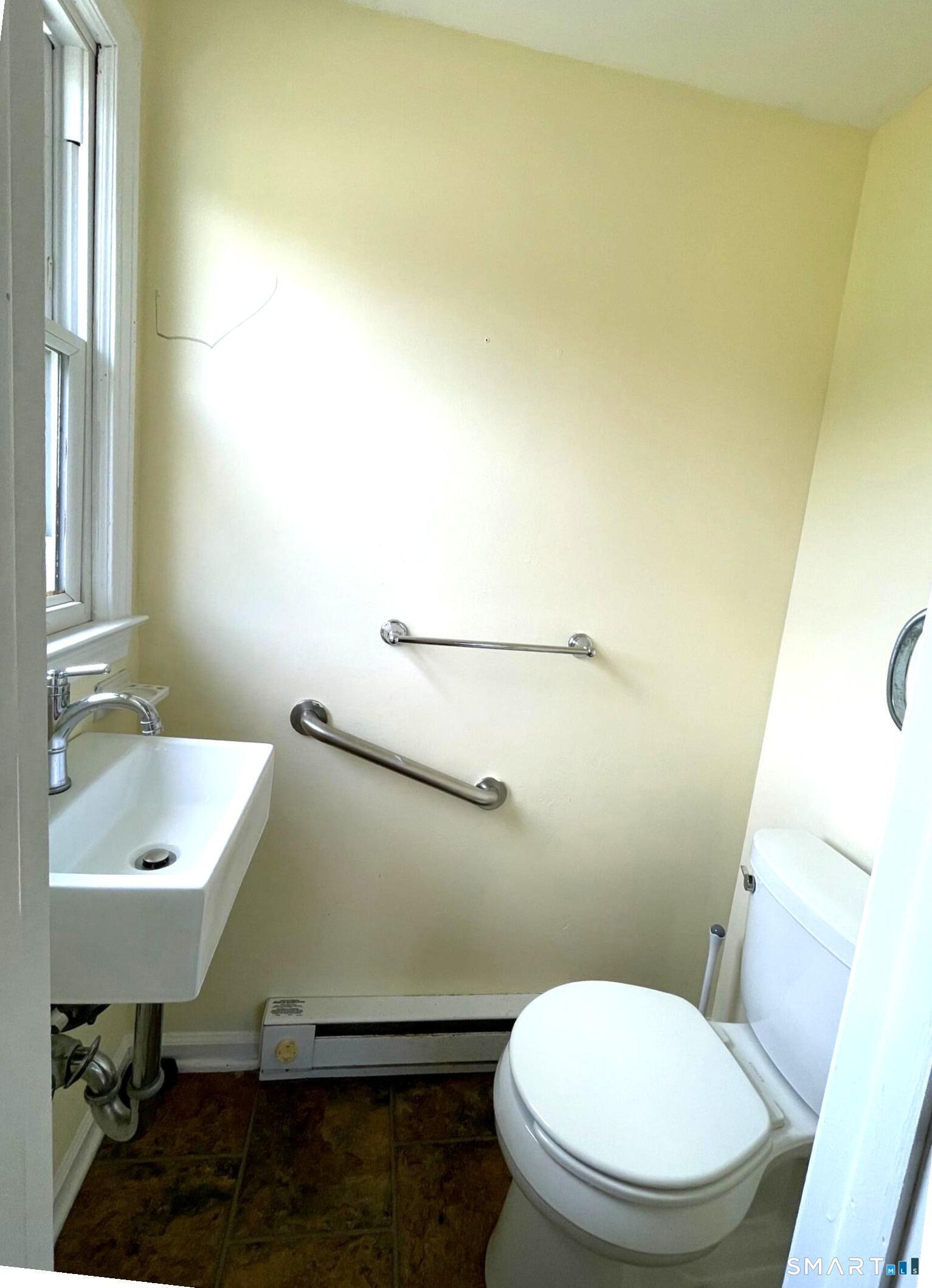 18 Old South Cove Road Old Saybrook, CT 06475 - Photo 31 of 40 a bathroom with a toilet and a sink