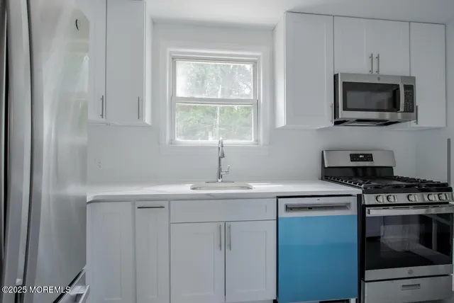 a view of an empty room with a floor to ceiling window and a floor to ceiling window