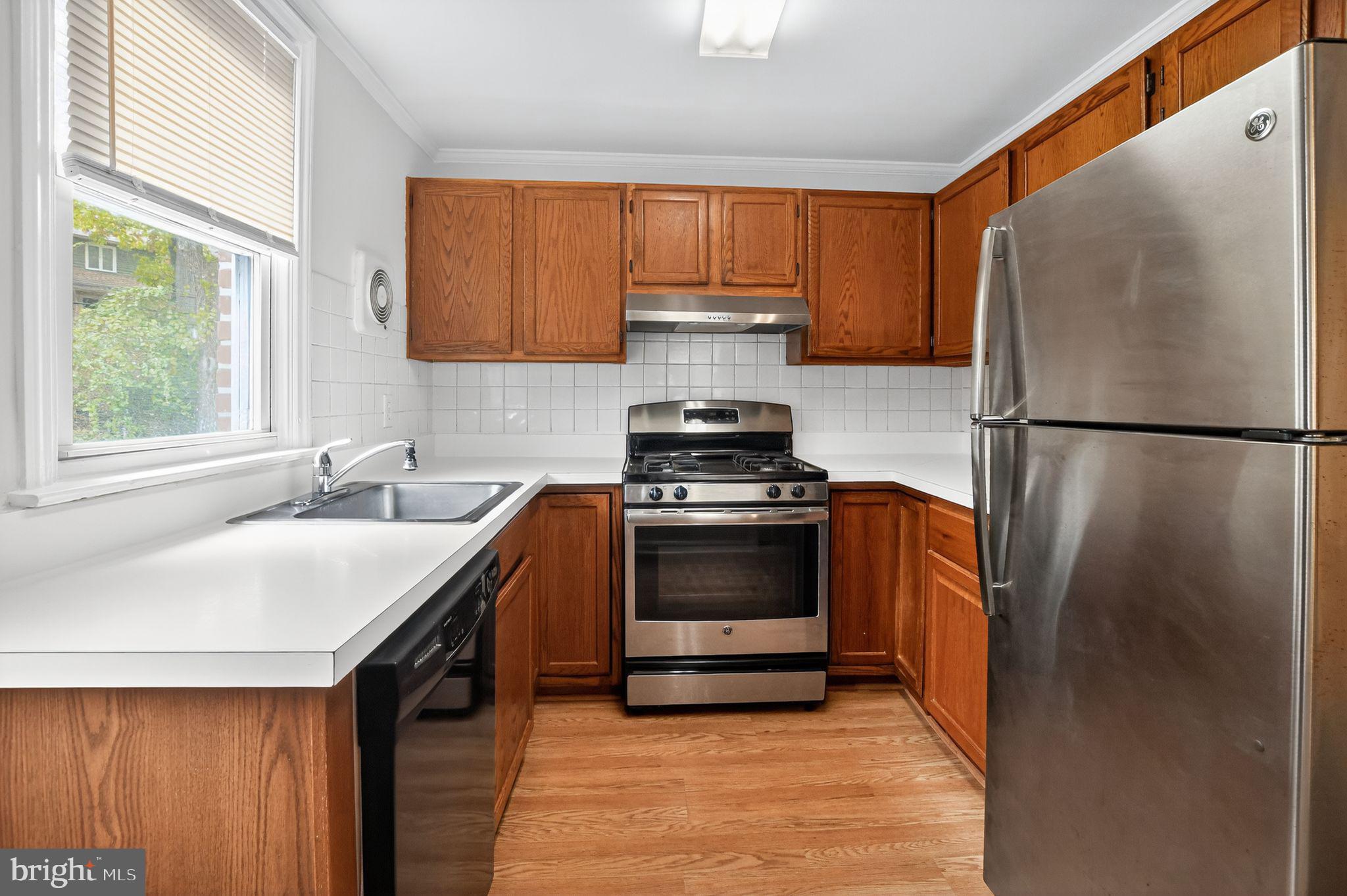 276 Valley View Road Malvern, PA 19355 - Photo 5 of 15 a kitchen with a refrigerator sink and stove