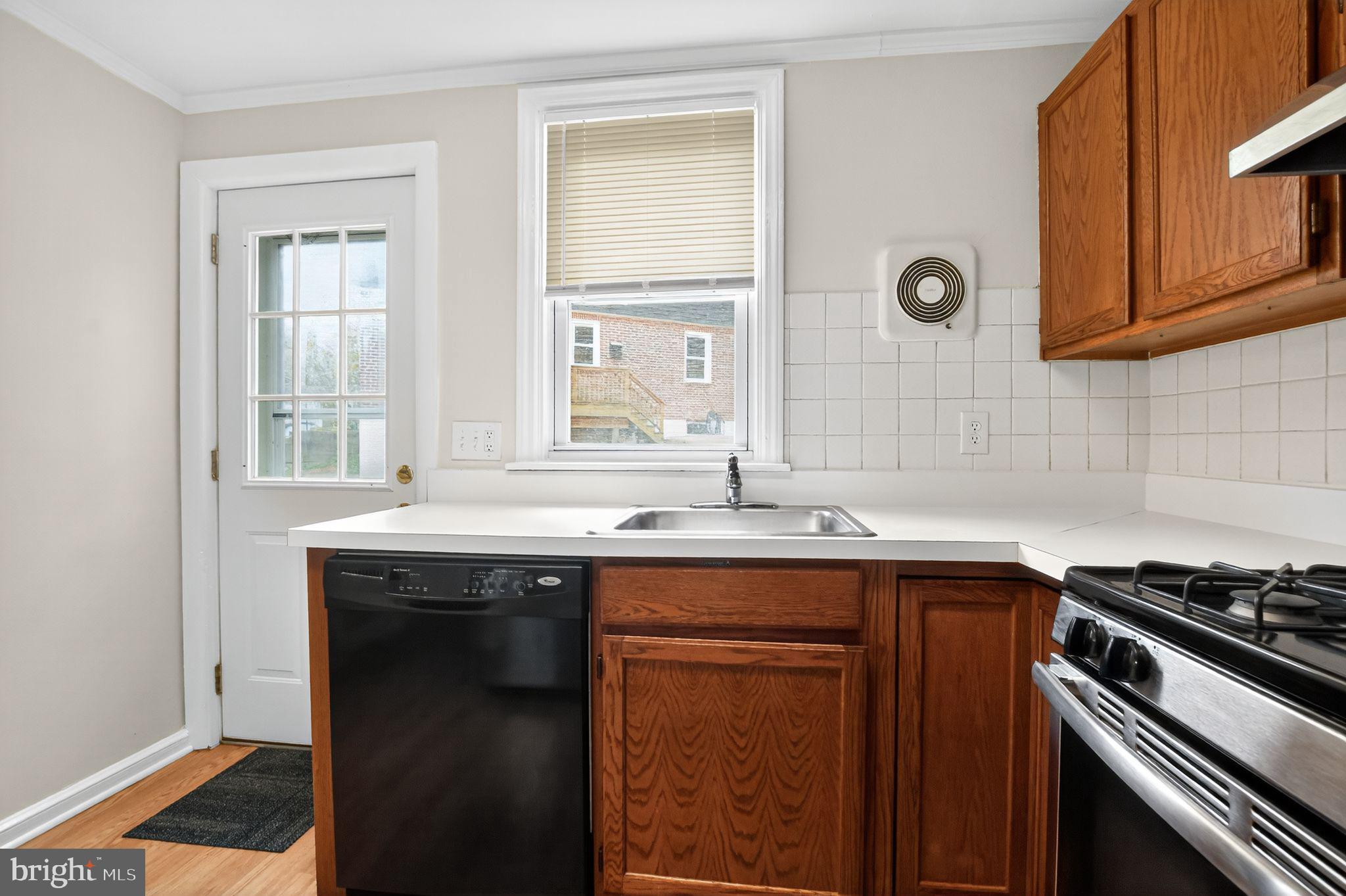 276 Valley View Road Malvern, PA 19355 - Photo 6 of 15 a kitchen with a sink stove and cabinets