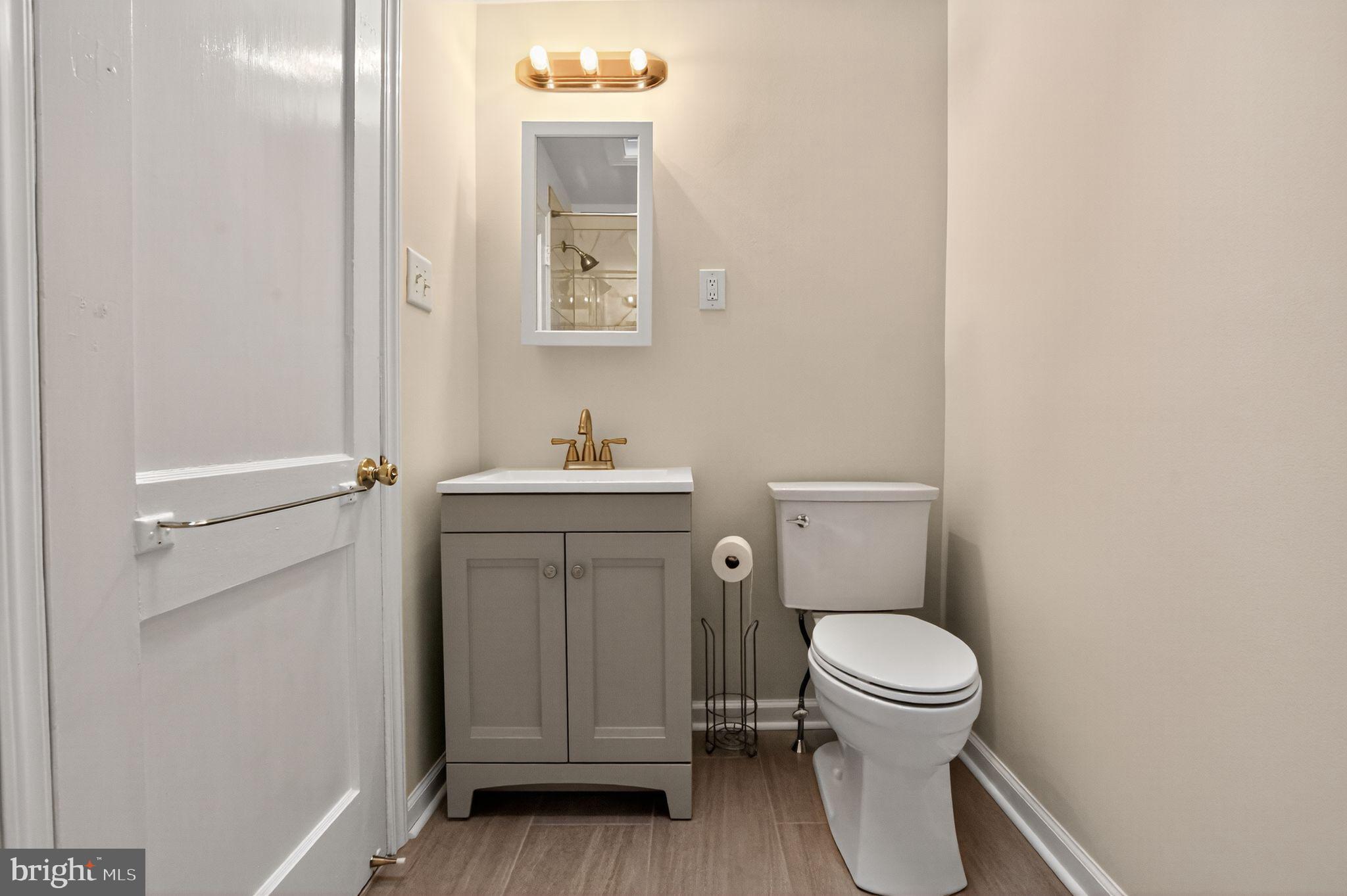 276 Valley View Road Malvern, PA 19355 - Photo 7 of 15 a white toilet sitting next to a bathroom sink